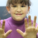 Community-Center-Gardening-Kid-Hand.jpg