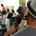 Educational-Center-Volunteer-Playing-Song-150x150-1.jpg